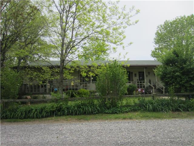 MAIN HOUSE WITH 4 BEDROOMS, 2 FULL BATHS. GREAT FRONT PORCH OVERLOOKING PROPERTY.