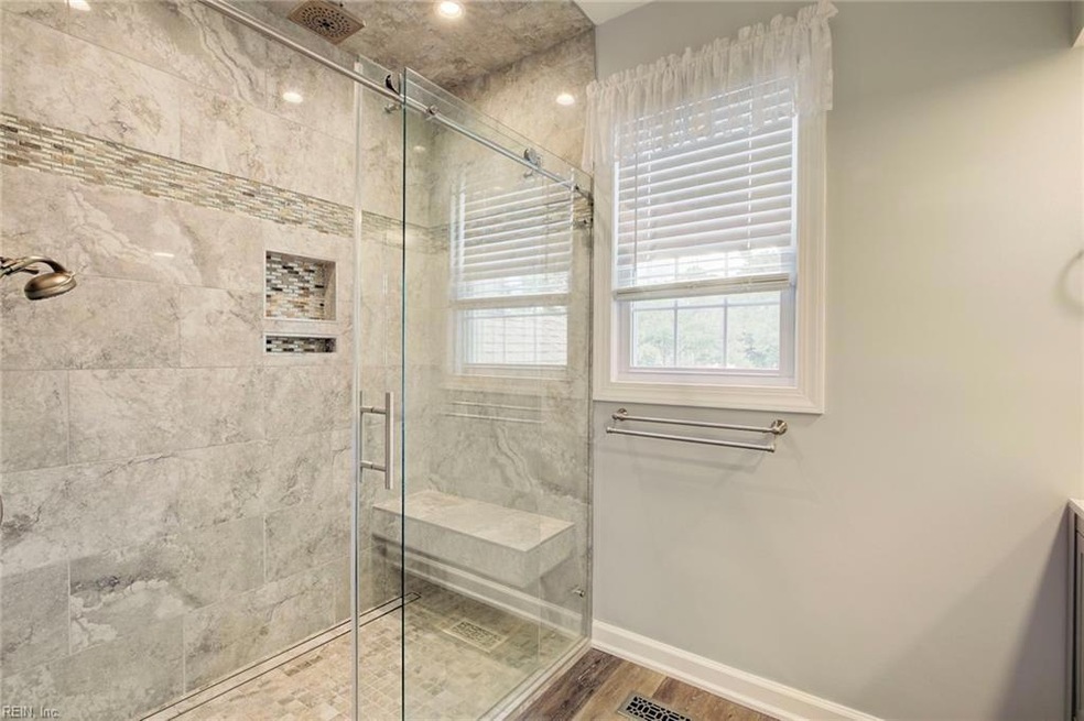 Check out this renovated primary bath with tiled s