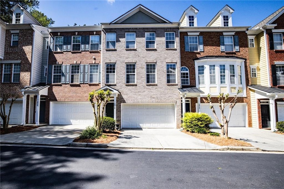 Multi unit property featuring brick siding, an att