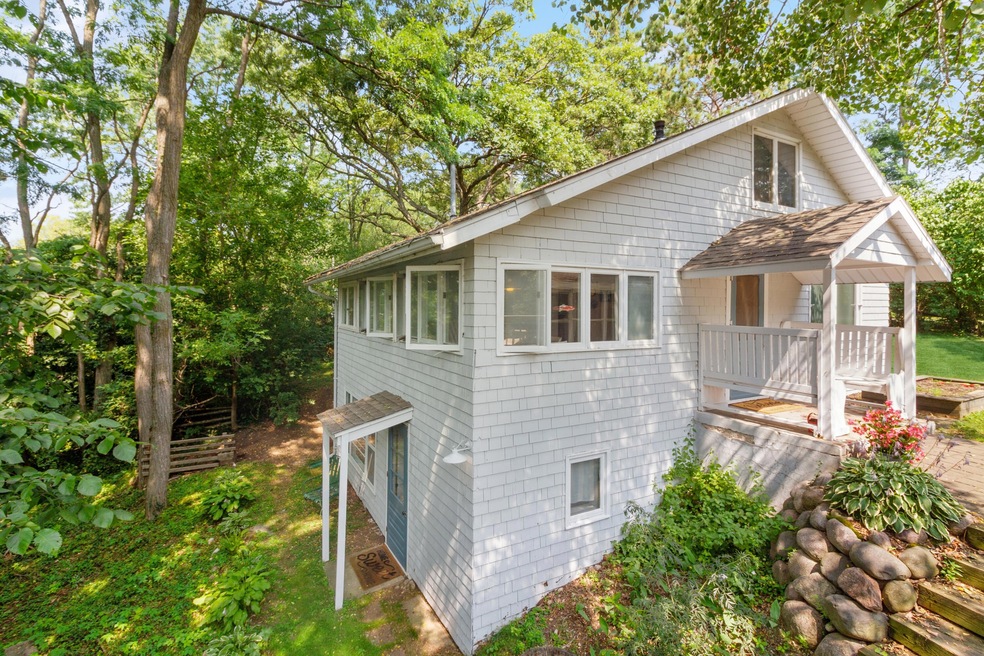Cape Cod Surrounded by Trees