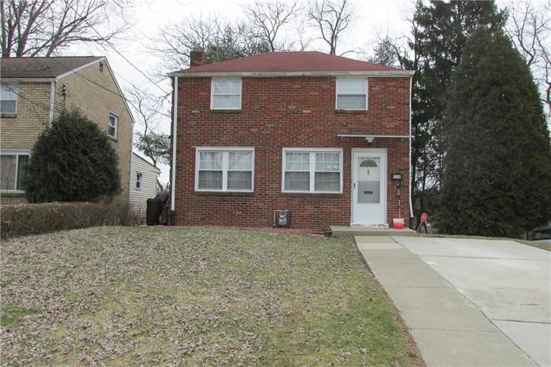 exterior front. large level front yard