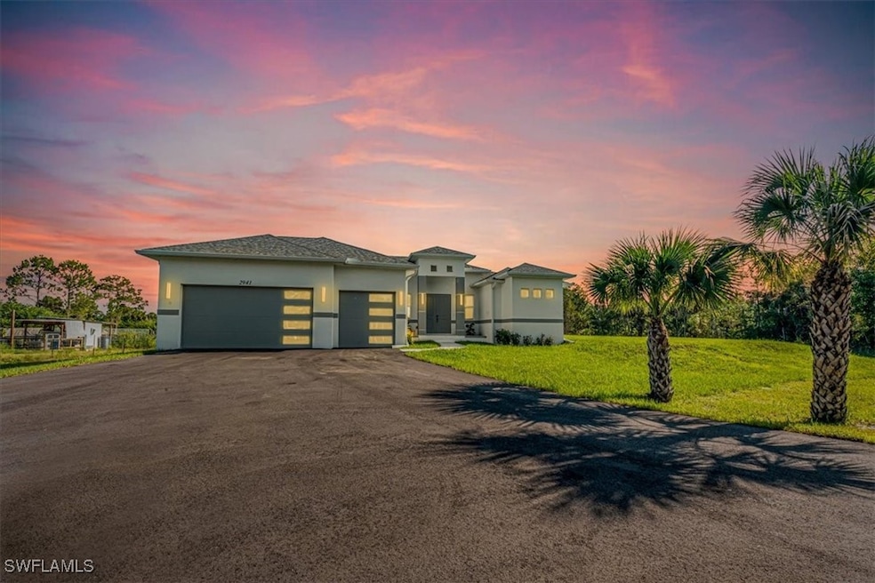 View of front of property with an attached garage,