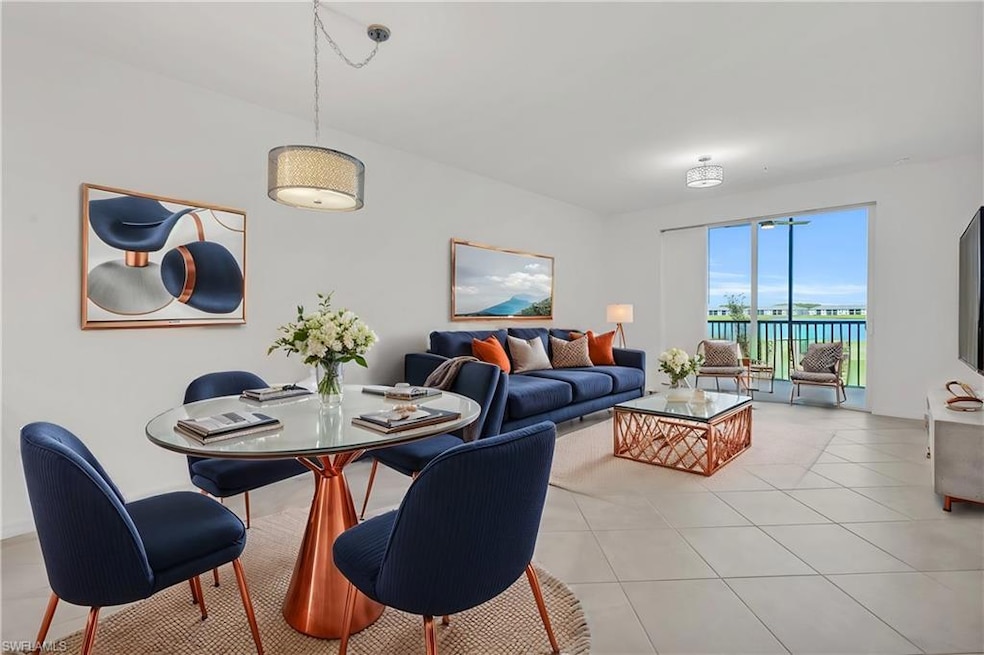 Dining area with light tile patterned floors