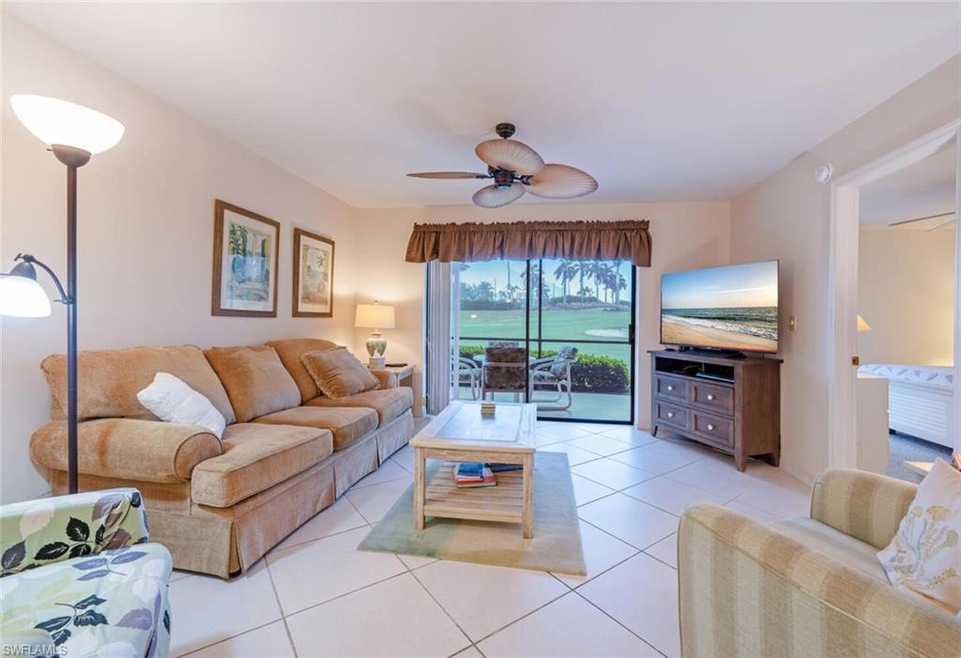 Living room featuring light tile patterned floors 