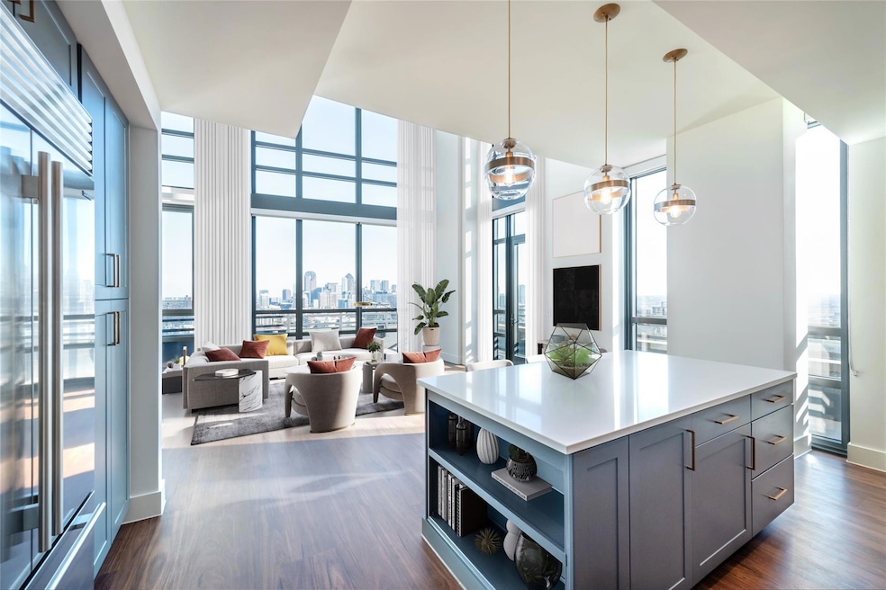 Kitchen featuring dark wood-style floors, open she