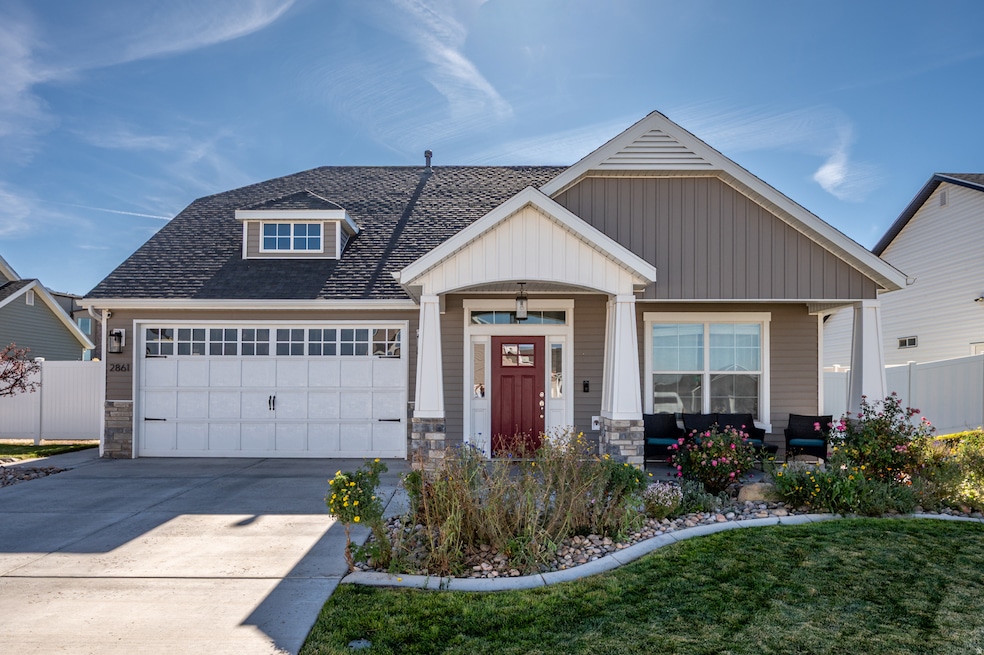 Craftsman house with stone siding, roof with shingles, concrete driveway, covered porch, and an attached garage