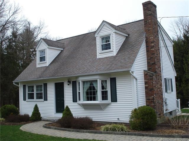 Front view with paver sidewalk leading to the fron