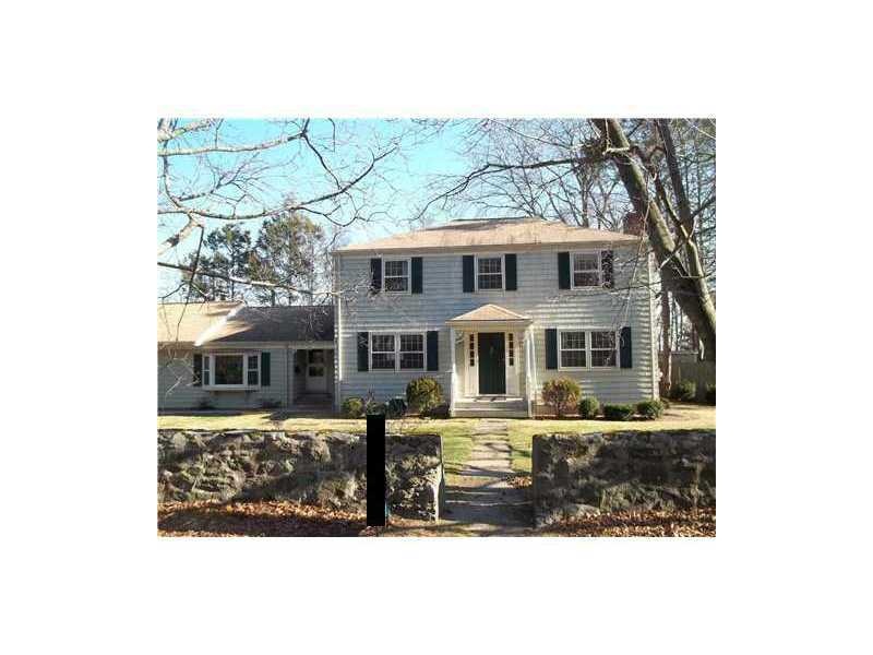 Exterior Front. gracious stone walls on a lovley c