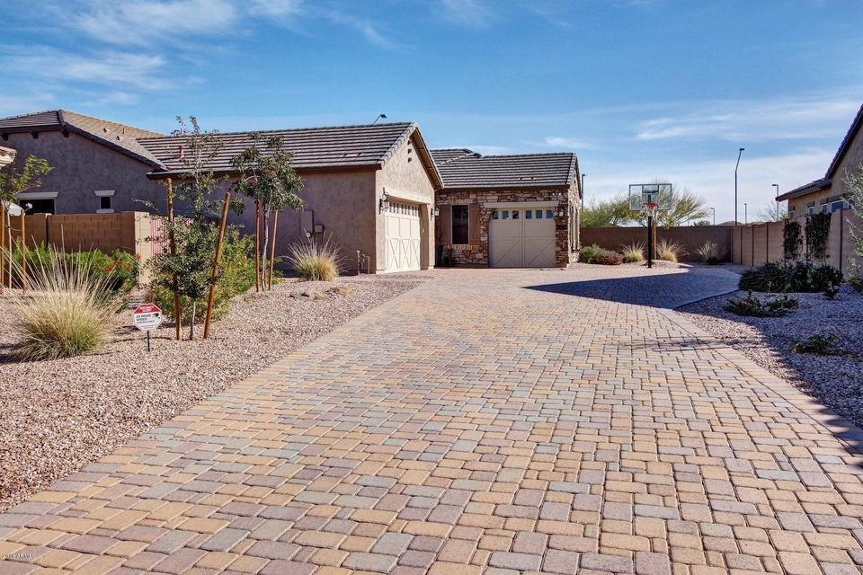 3-car garage & long, pavered driveway