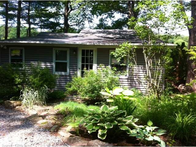 Exterior Front. Front of Cottage with perennial ga