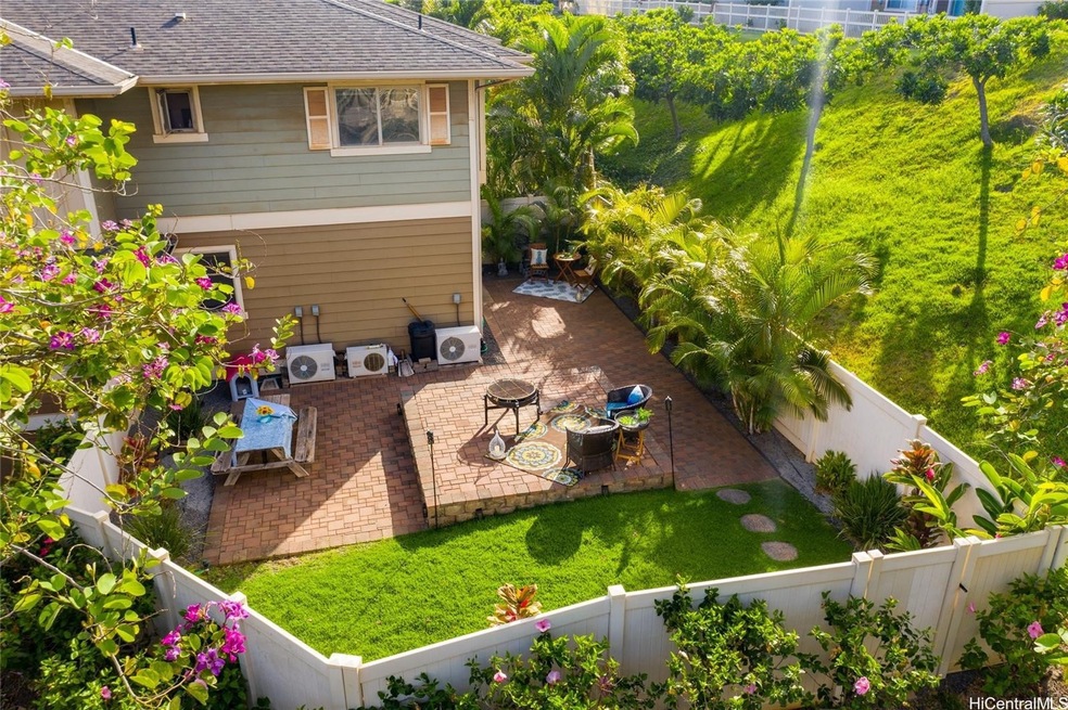 A beautifully landscaped backyard with lush green