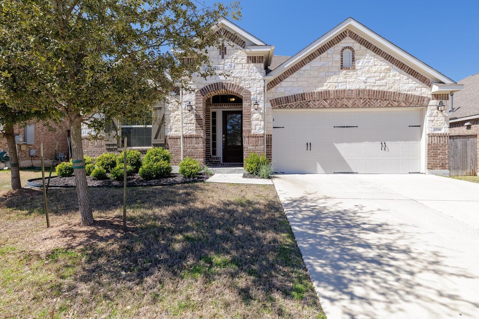 French country style house with brick siding, an 