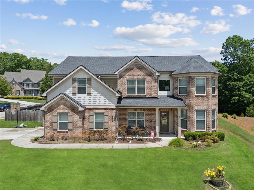 View of front of home with brick siding and a shin