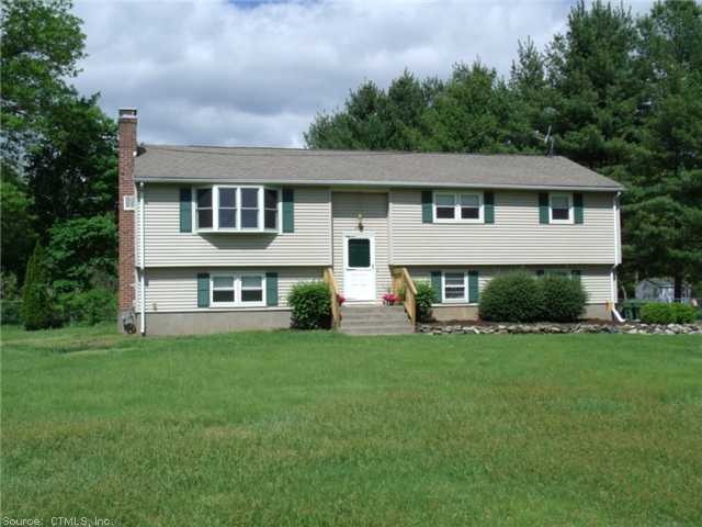 Exterior Front. BEAUTIFULLY SET ON .64 ACRE PROFES