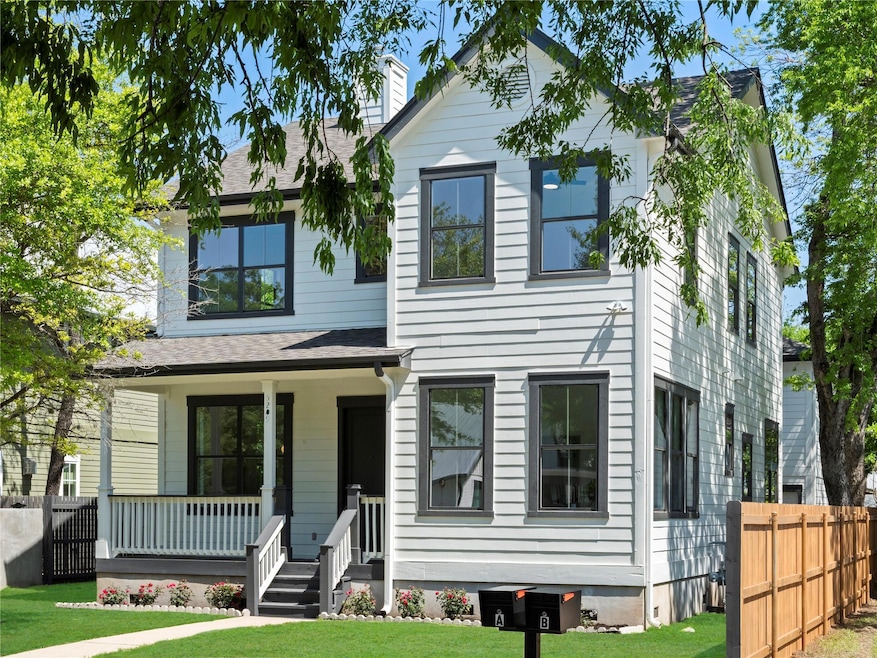 View of front of property featuring a shingled ro