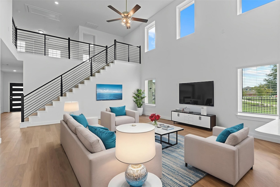 Ready for move in!  Start your memories today! What can you say when you open that chic upgrade stylish Door to this Dramatic Two-story High Ceiling of wall of windows!  Wow!   Gorgeous Large Plank Wood like tile floors!  What a stunning home, come by and see it today! **Image Representative of Plan Only and May Vary as Built**.