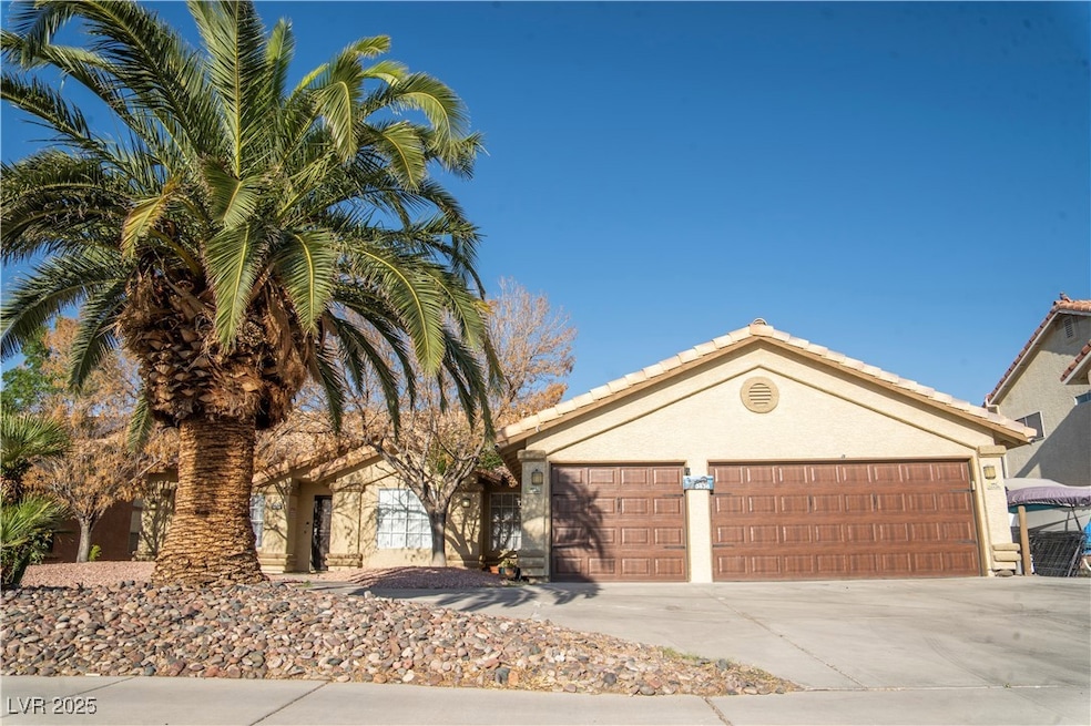 Single story home with concrete driveway, stucco s