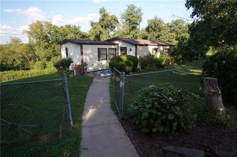 set on 2 acres w public water and partially enclos