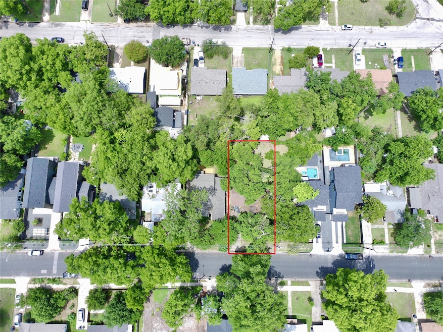 Aerial view of residential area with property par