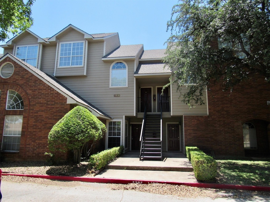 View of front of property featuring brick siding, 