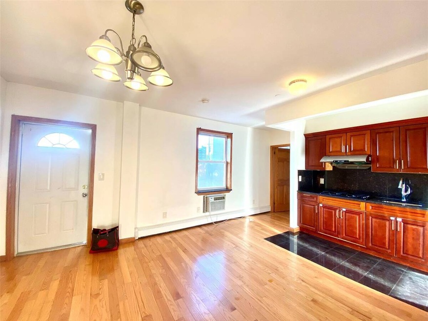 Kitchen with dark wood finished floors, decorative