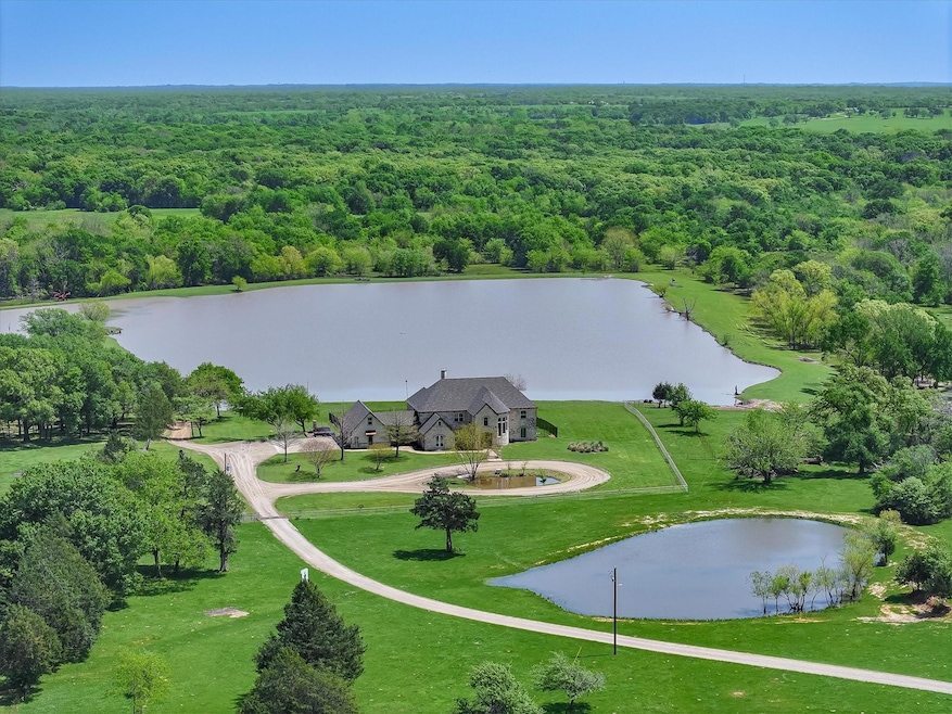 stunning home on 493 acre overlooking 13 acre lake