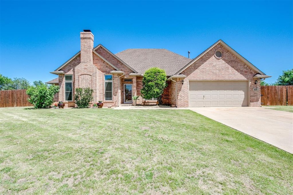 View of front of house featuring a garage and a fr