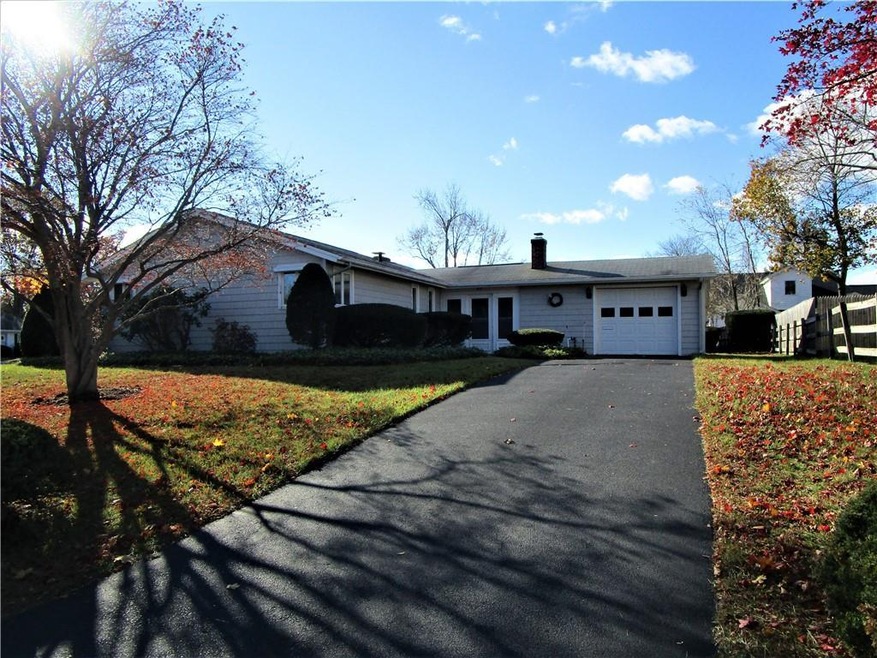Front of home, ample driveway space, 1 car garage