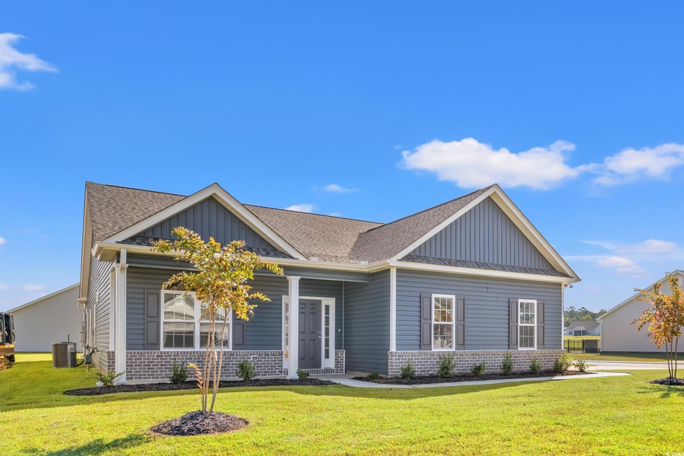 Craftsman-style house featuring a front lawn and c