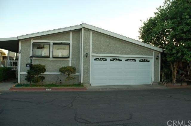 Front of unit, has true, 2 car attached garage wit