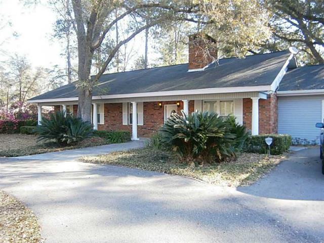 Photo. Circle drive graces this brick & vinyl  hom
