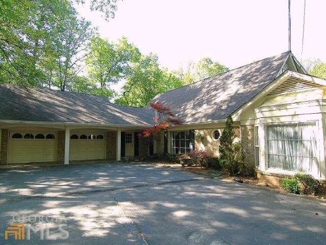 This all brick home has the charm of a cottage and