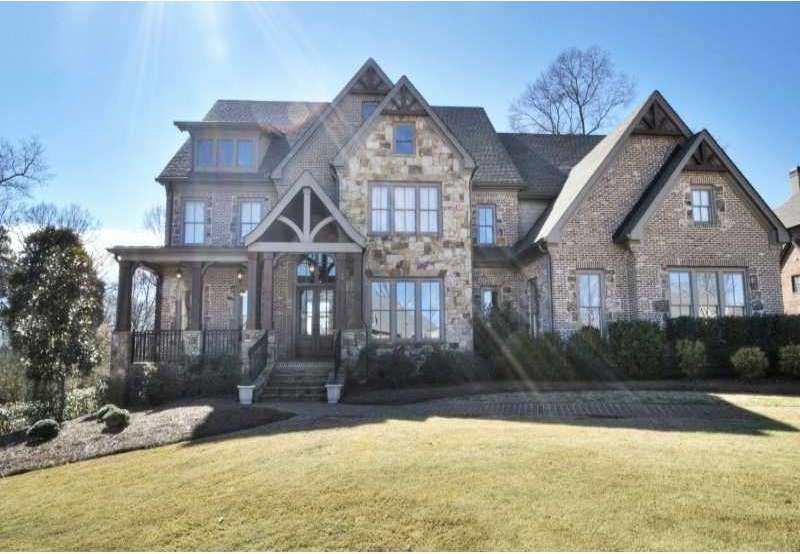 Exterior Front. Elements of Stone and Brick make u
