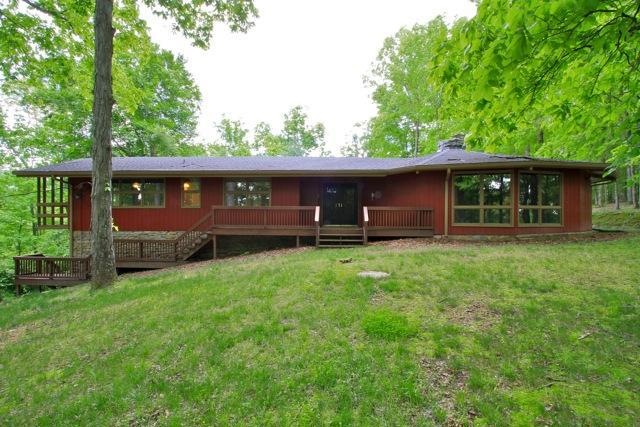 Come home to this beautiful tree house retreat on 24 acres in Liepers Fork!