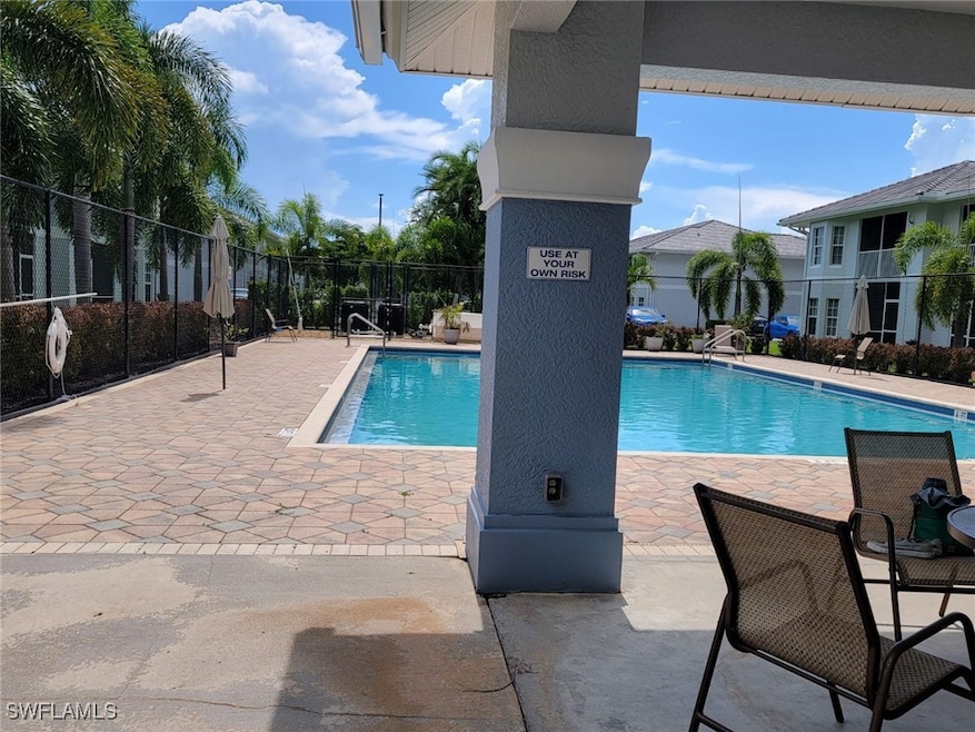 Community pool featuring a patio