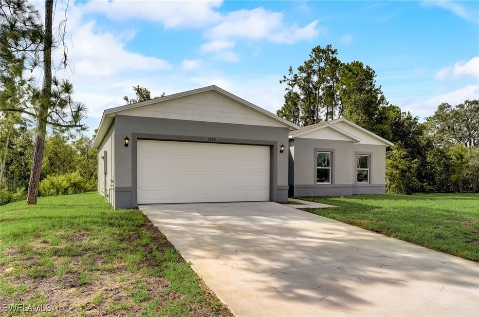 Ranch-style home with a front lawn and a garage