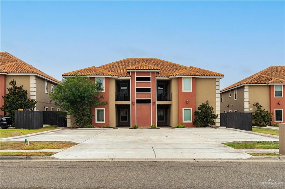 View of front of property with a tiled roof and stucco siding.. Unit C is the one at the bottom to the left side.