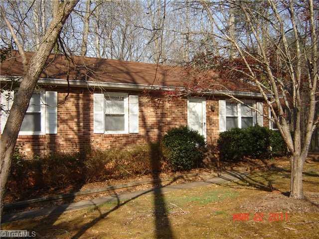 Exterior Front. The trees in front of the house will be removed soon.