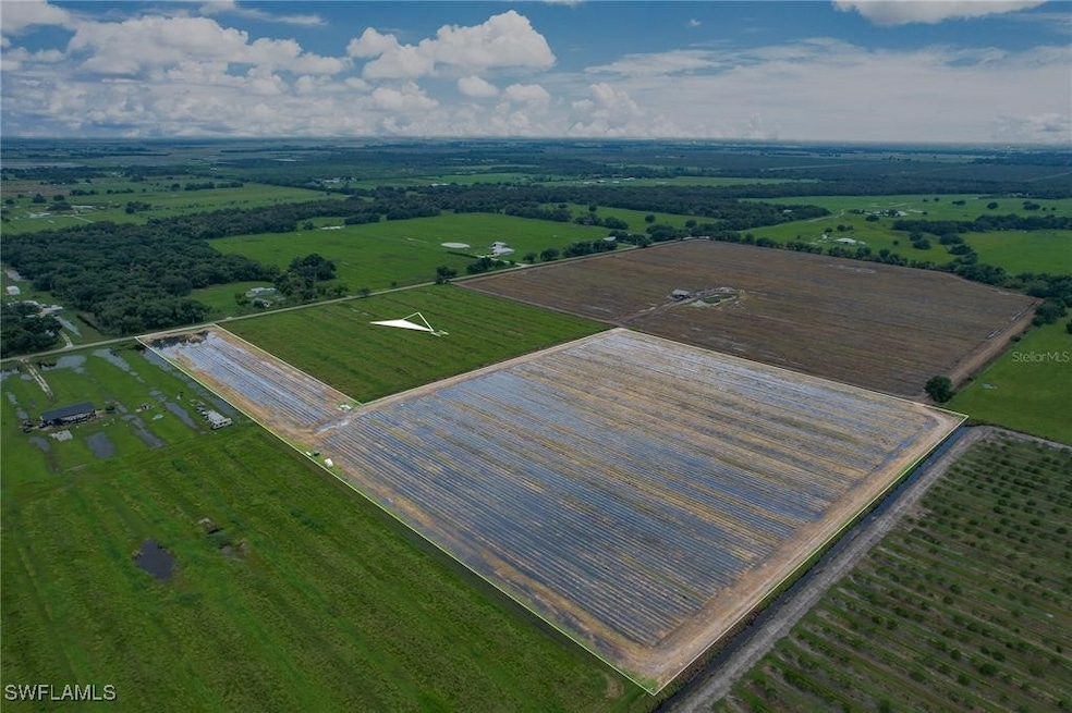 Birds eye view of property with a rural view