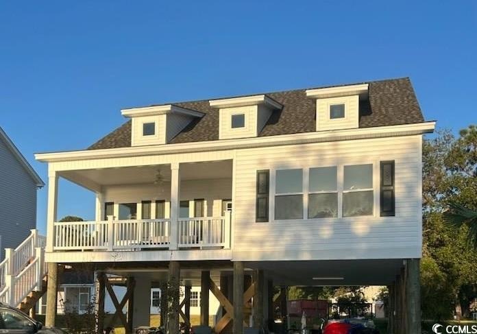 Back of property featuring a carport