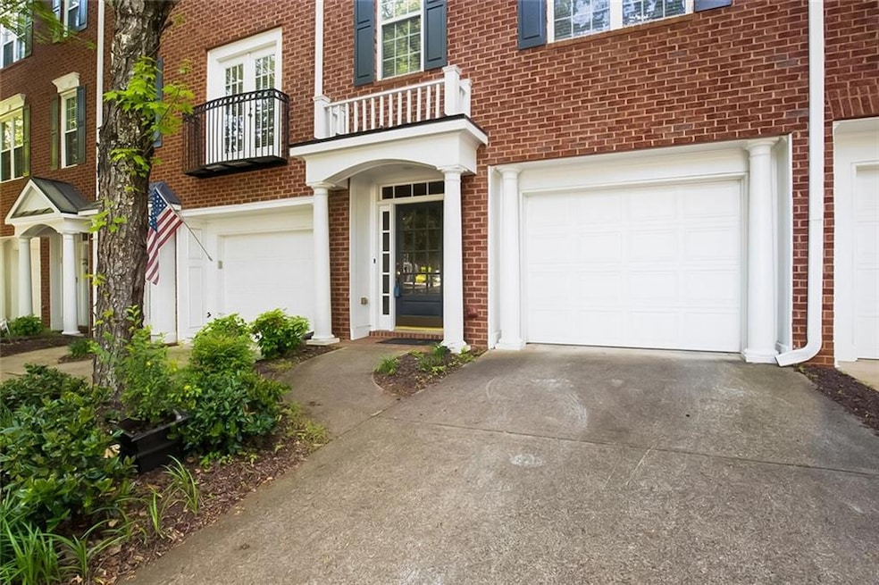 Entrance to property featuring an attached garage,