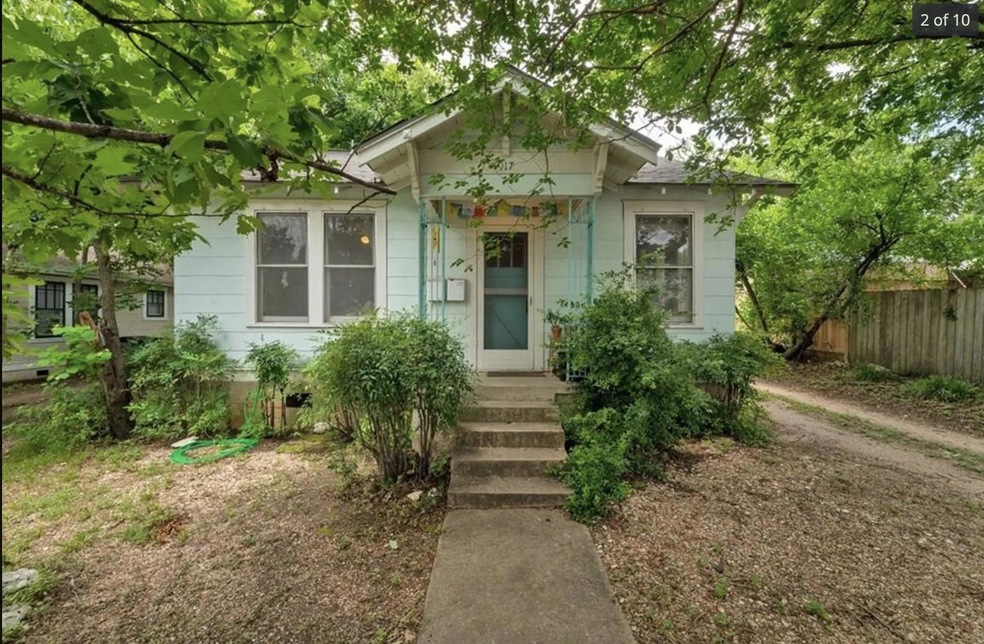 Bungalow-style house featuring fence