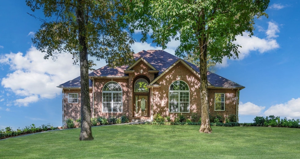 STUNNING LUXURY HOME on 1.27 Acres+/- in Burns!!! 3 Full Bedrooms + 2.5 Bathrooms plus Media Room/4th Space Attached 2-Car Garage + Aggregate Driveway *Note: this photo is edited so home details are visible
