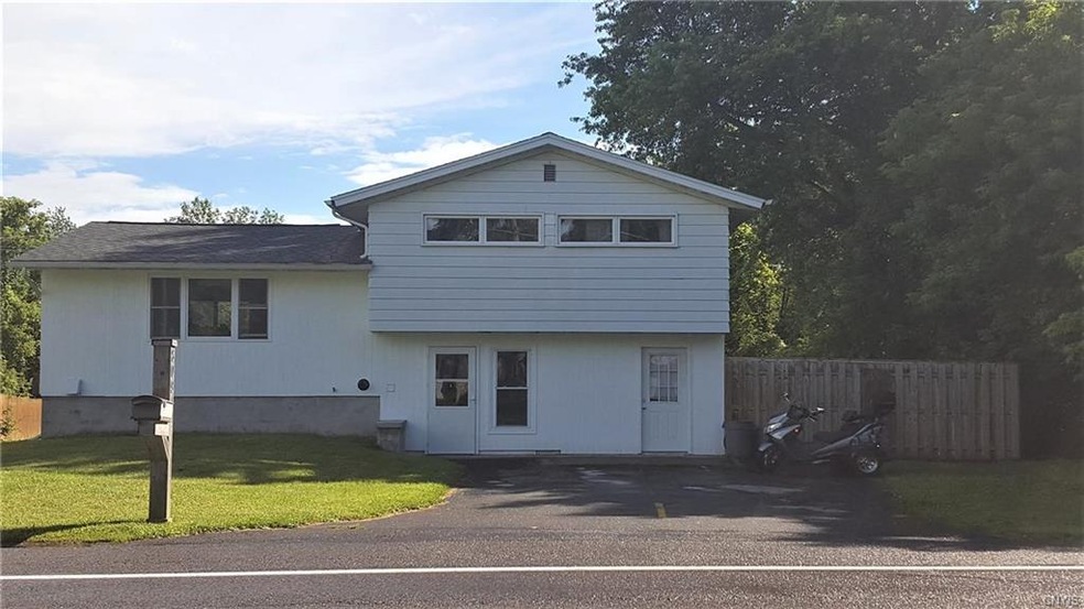 Front of the house.  Double wide driveway