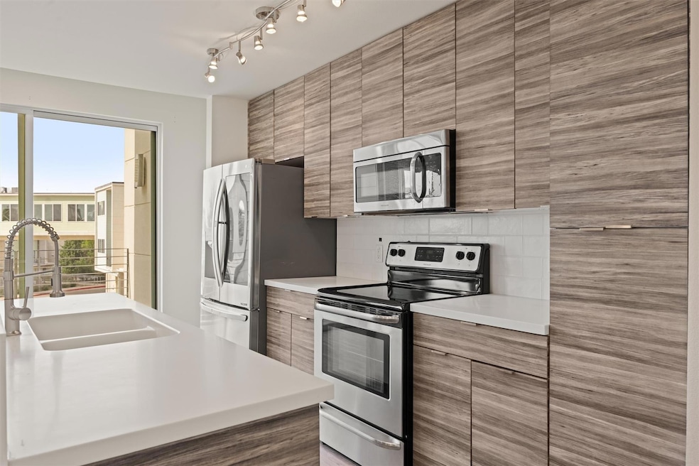 Kitchen with stainless steel appliances, modern c