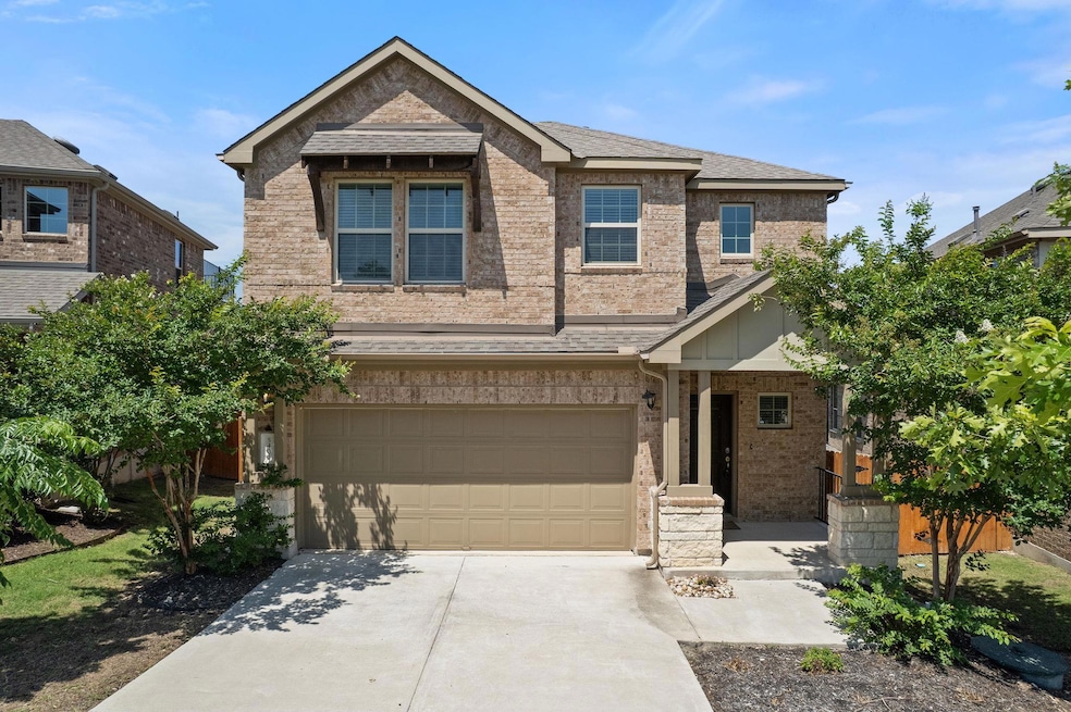 View of front of property with concrete driveway,