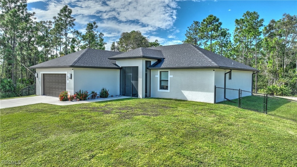 View of front of house with stucco siding, driveway, a garage, and a shingled roof