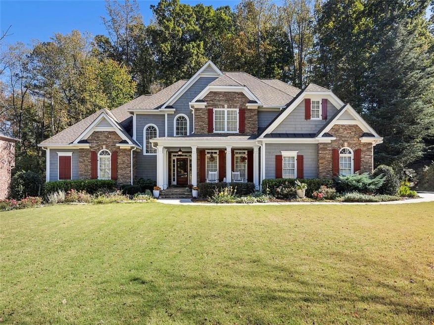 Craftsman-style house featuring a front yard and c