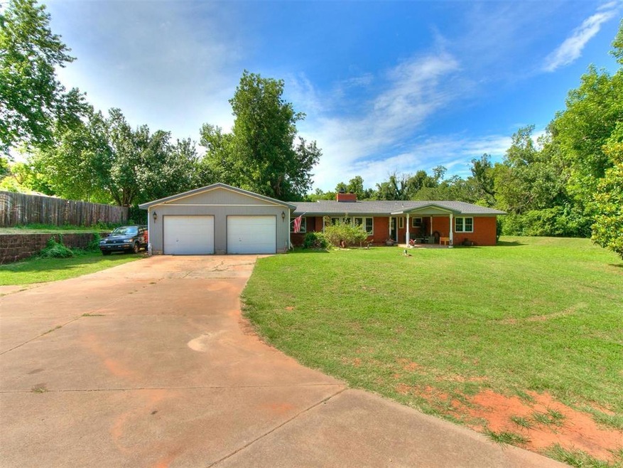 Single story home featuring a garage and a front l