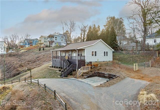 Front of home showing driveway and parking area